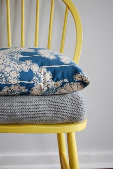 florence broadhurst cushions on yellow chair.jpg
